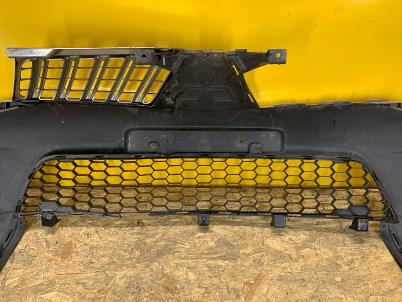 Бампер передний L200 06-14