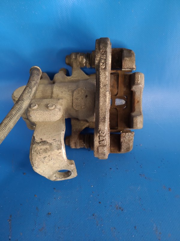 Суппорт тормозной задний левый CIVIC 4D 06-11