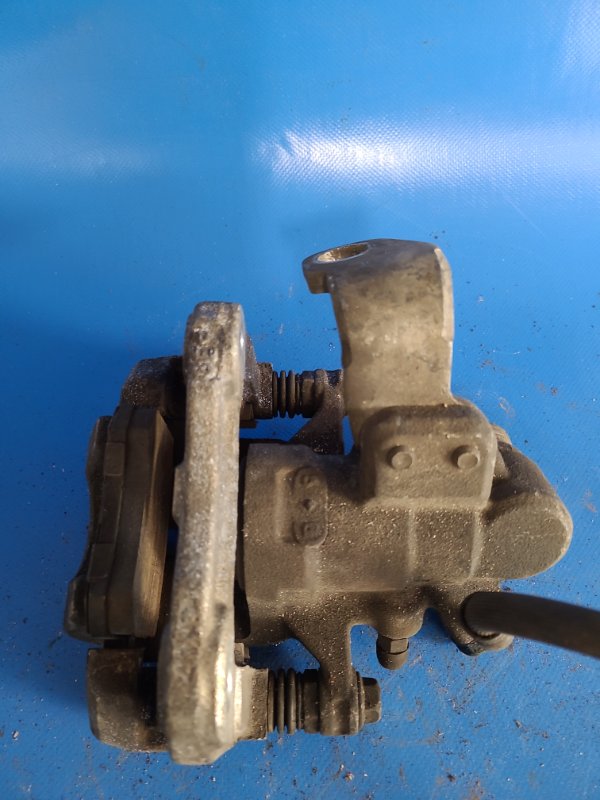 Суппорт тормозной задний левый CIVIC 4D 06-11