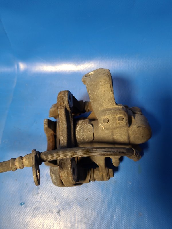 Суппорт тормозной задний левый CIVIC 4D 06-11