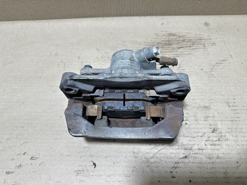 Суппорт тормозной задний левый FORESTER SH 07-12