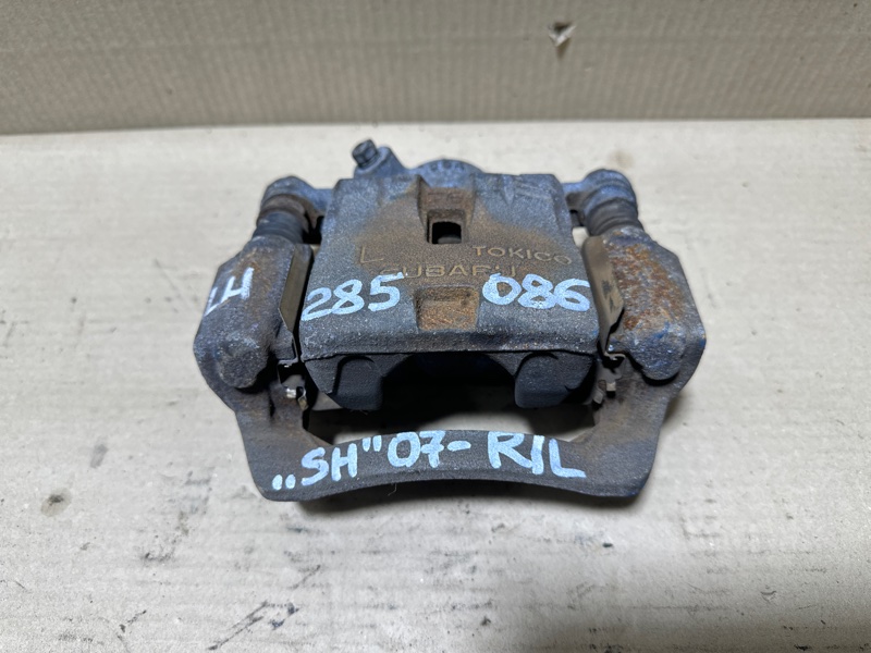 Суппорт тормозной задний левый FORESTER SH 07-12