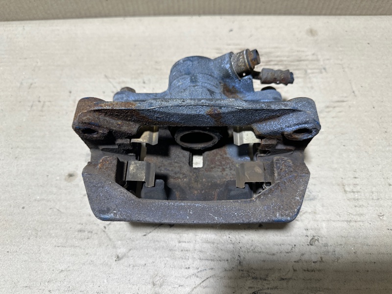 Суппорт тормозной задний левый FORESTER SH 07-12