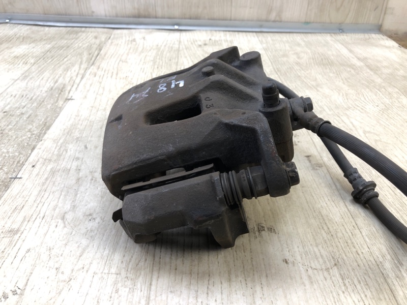 Суппорт тормозной передний левый NISSAN NV200 USA 13- 2.0 MR20DE