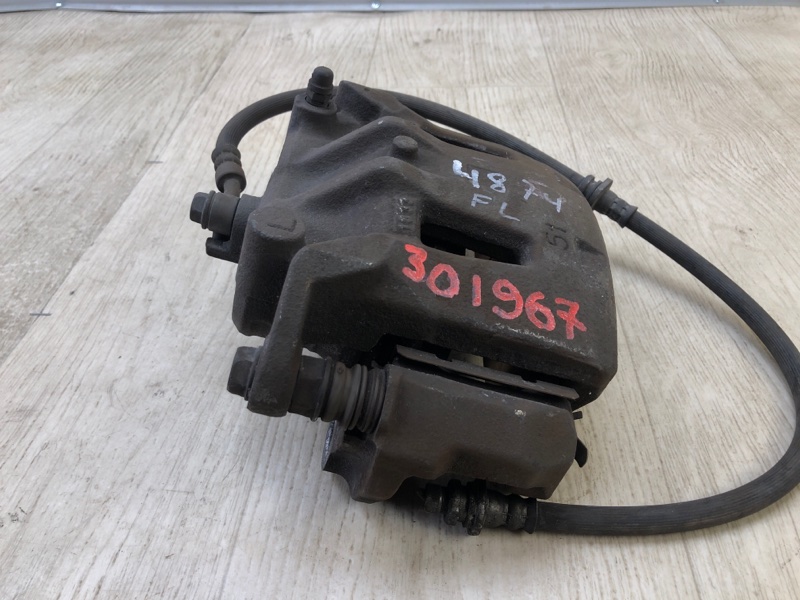 Суппорт тормозной передний левый NV200 USA 13- 2013 2.0 MR20DE