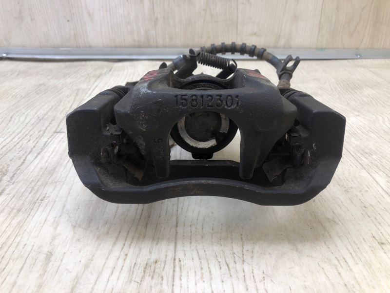 Суппорт тормозной задний левый GRAND CARAVAN 08-