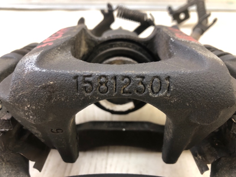 Суппорт тормозной задний левый GRAND CARAVAN 08-