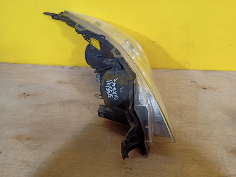 Фара левая OUTBACK 09-14 BR