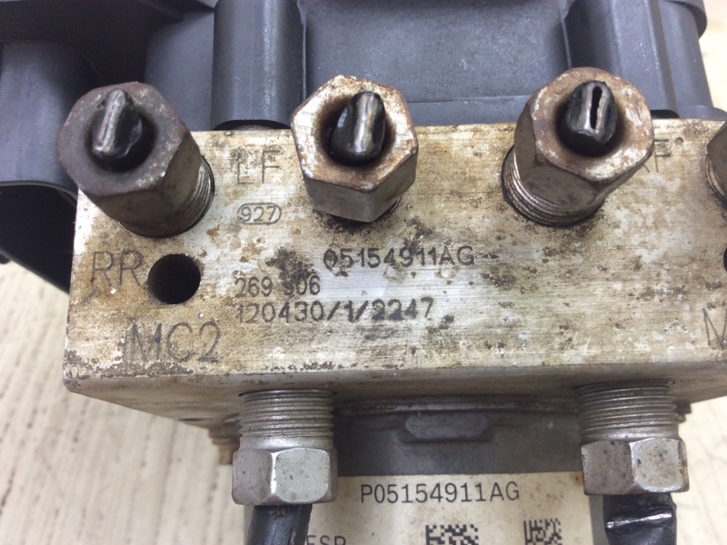 Блок ABS GRAND CARAVAN 08-