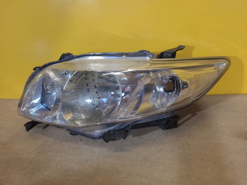 Фара левая COROLLA 150 06-13