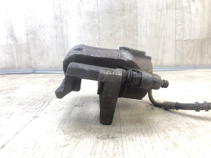 Суппорт тормозной передний левый DODGE GRAND CARAVAN 08-