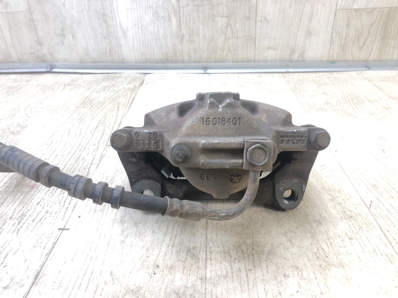 Суппорт тормозной передний левый GRAND CARAVAN 08-