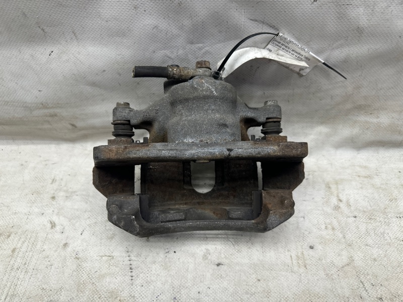 Суппорт тормозной передний левый TOYOTA COROLLA 150 06-13