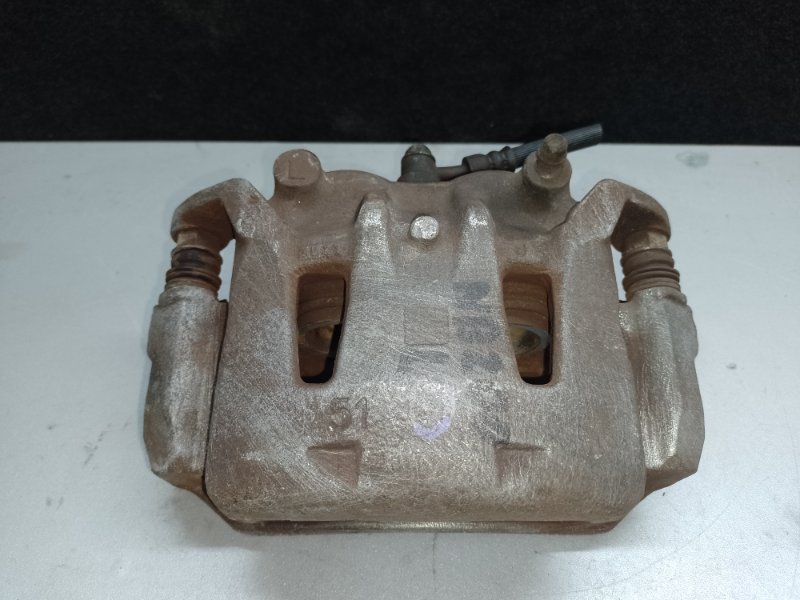 Суппорт тормозной передний левый NISSAN NV200 USA 13- 41011-3LM0A Б/У