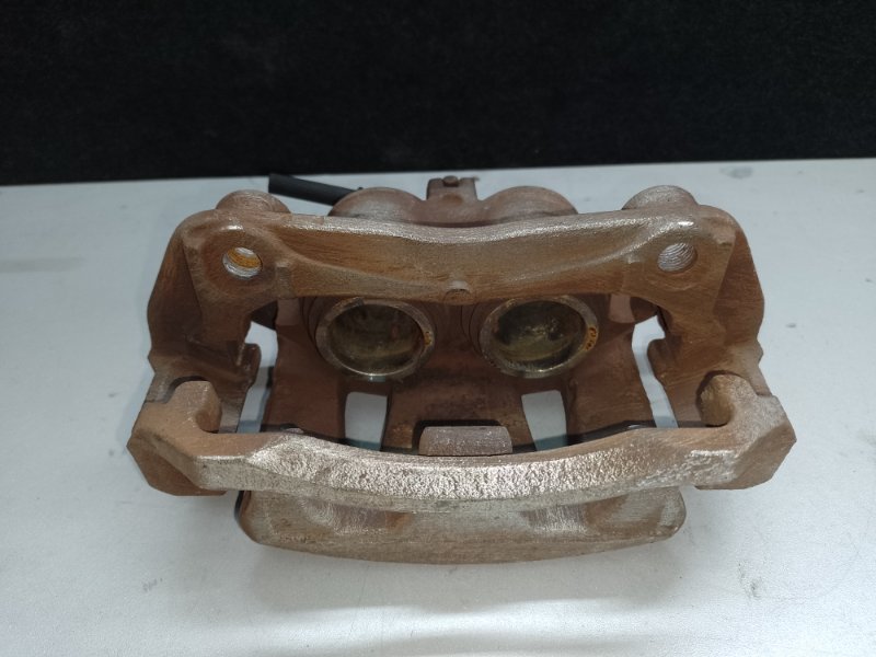 Суппорт тормозной передний левый NV200 USA 13-