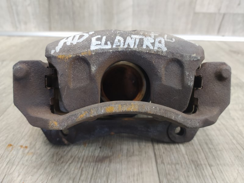 Суппорт тормозной передний левый ELANTRA HD 06-11