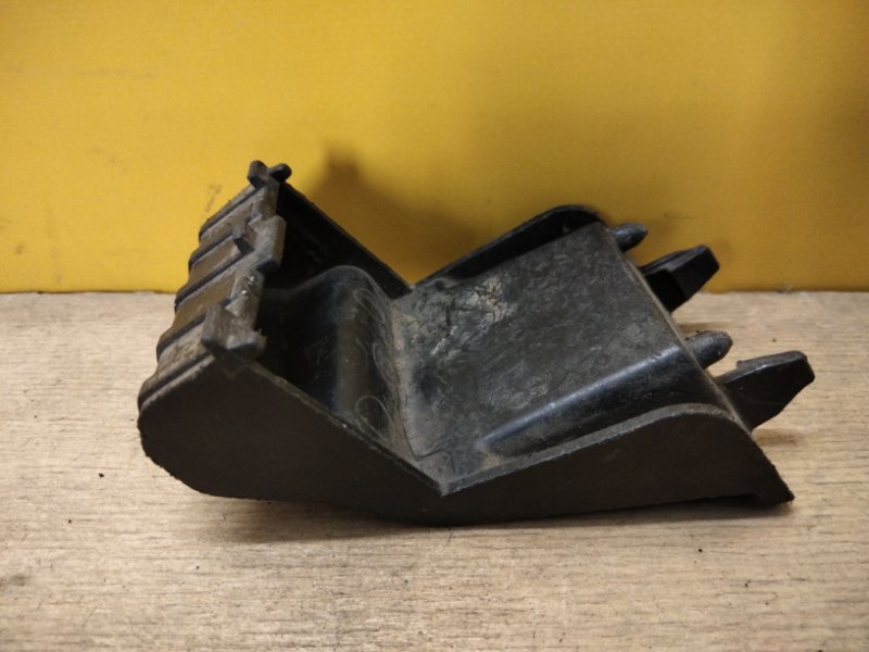 Кронштейн переднего бампера (под фарой) левый CX-7 06-12