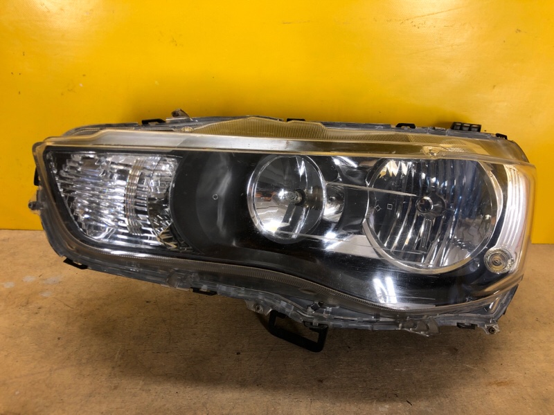 Фара левая MITSUBISHI LANCER X 10 07-15 Фара левая MITSUBISHI LANCER X 10 07-15