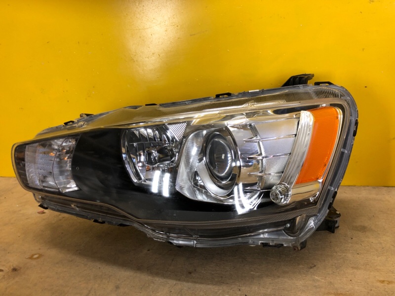 Фара левая MITSUBISHI LANCER X 10 07-15 Фара левая MITSUBISHI LANCER X 10 07-15