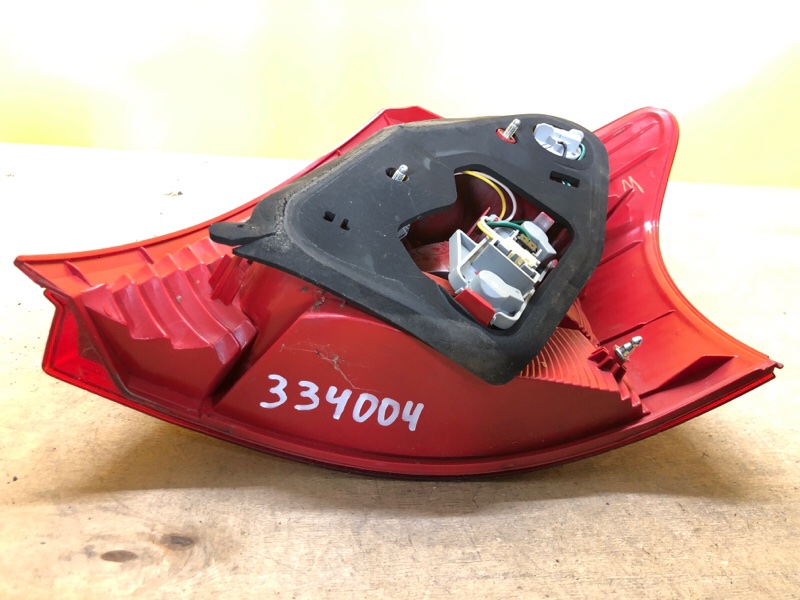 Фонарь наружный левый YARIS 05–11