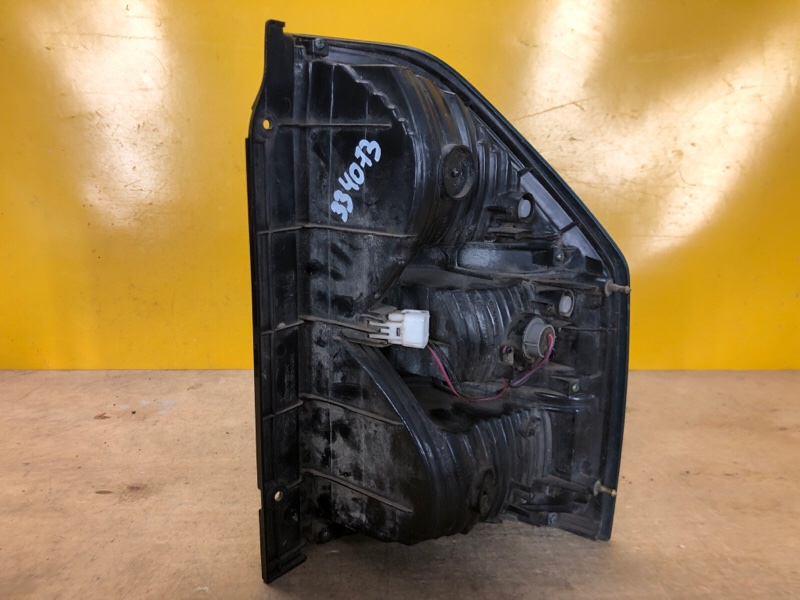 Фонарь наружный левый PAJERO 99-06