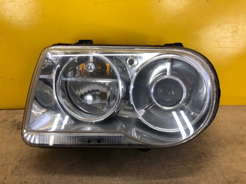 Запчасть фара левая CHRYSLER 300 04-10 4805 761AG Б/У Фара левая CHRYSLER 300 04-10 4805 761AG Б/У