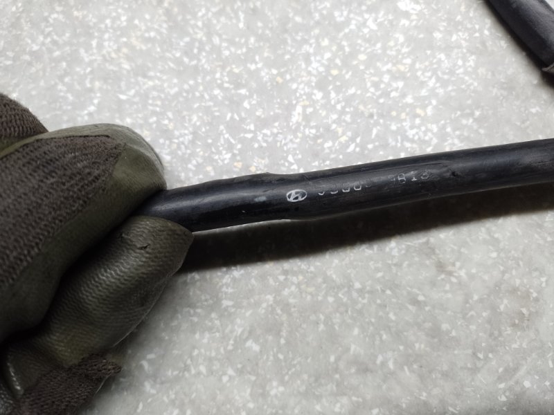 Трос стояночного тормоза левый KONA OS 17-23