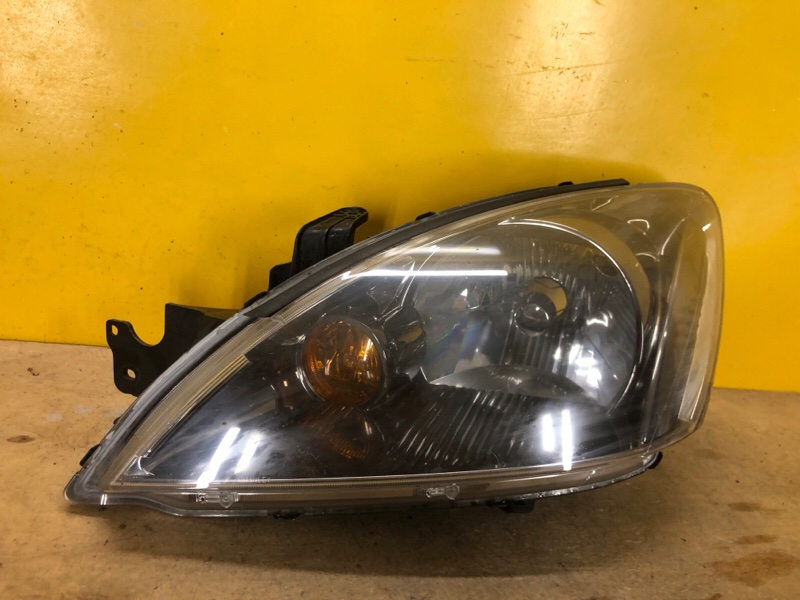 Фара левая MITSUBISHI LANCER IX 9 03-07