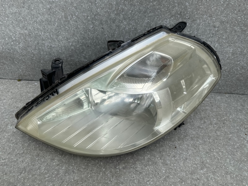 Фара левая TIIDA/VERSA C11 04-11