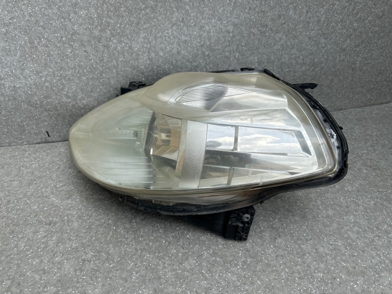 Фара левая NISSAN TIIDA/VERSA C11 04-11