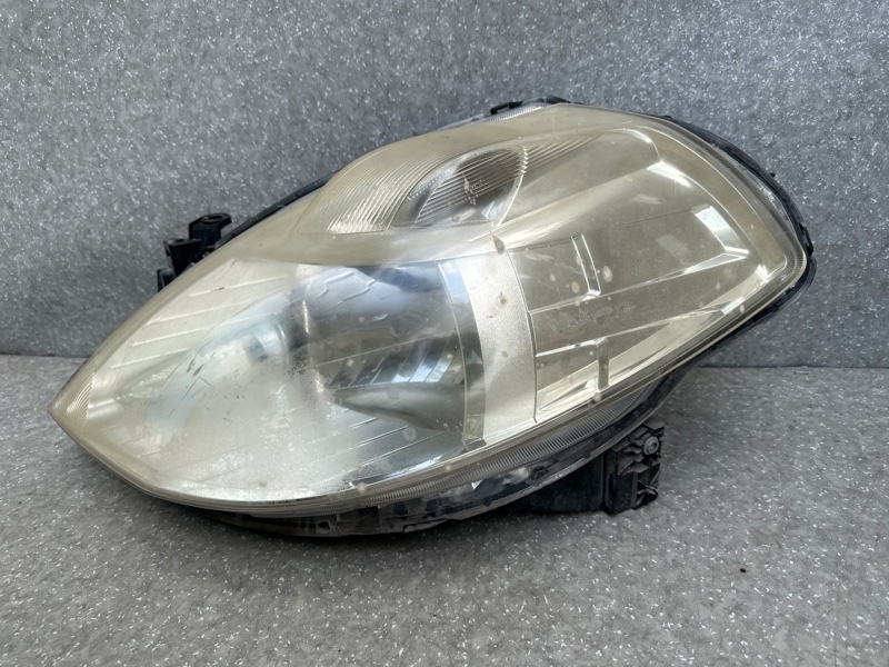 Фара левая NISSAN TIIDA/VERSA C11 04-11 Фара левая NISSAN TIIDA/VERSA C11 04-11