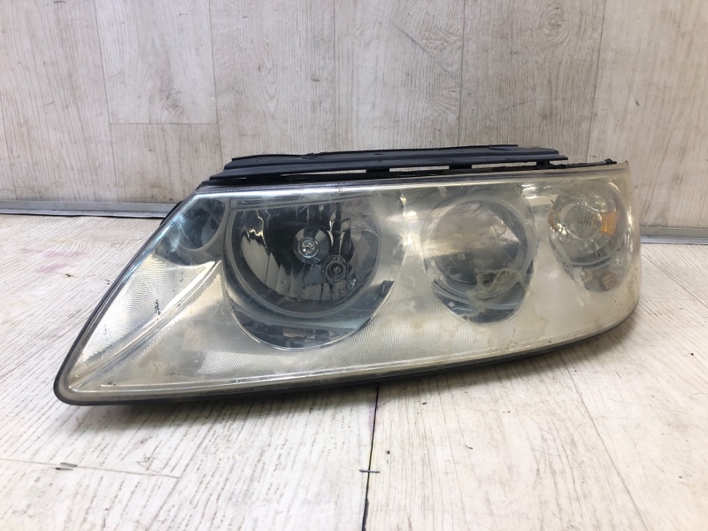 Фара левая GRANDEUR 05-11 TG