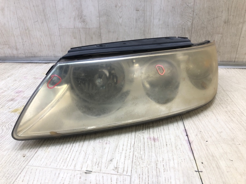 Фара левая GRANDEUR 05-11 TG