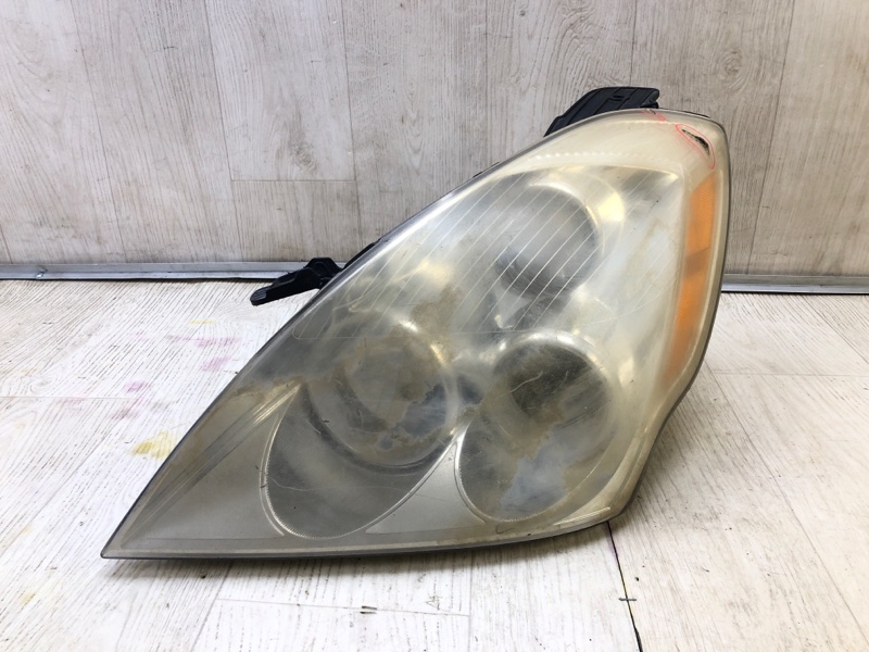Фара левая HYUNDAI ENTOURAGE 06-09 921014J000 Б/У
