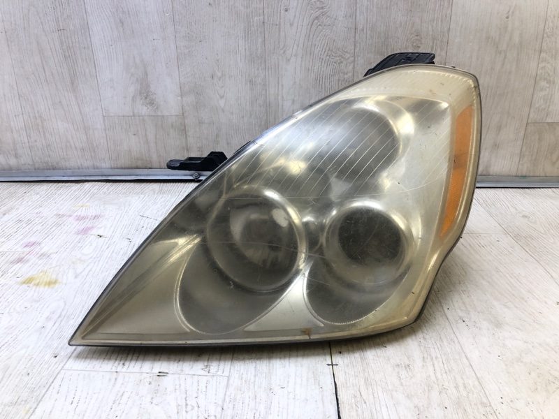 Фара левая HYUNDAI ENTOURAGE 06-09 921014J000 Б/У