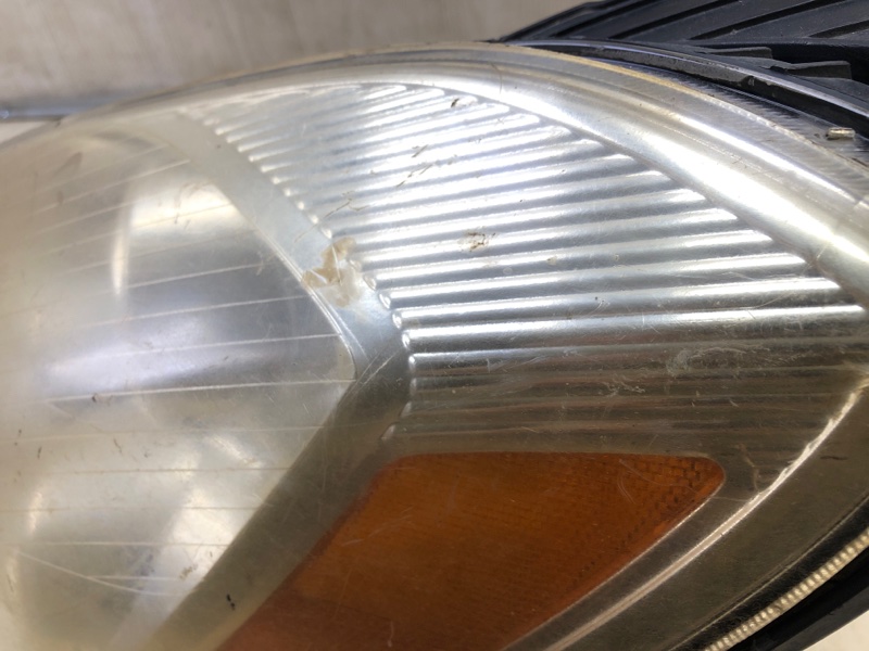 Фара левая ENTOURAGE 06-09