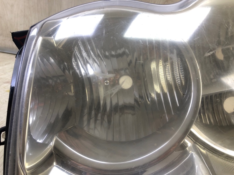 Фара левая GRAND CHEROKEE 04-10