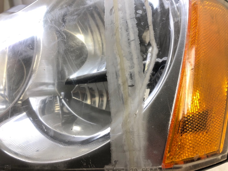 Фара левая GRAND CHEROKEE 04-10