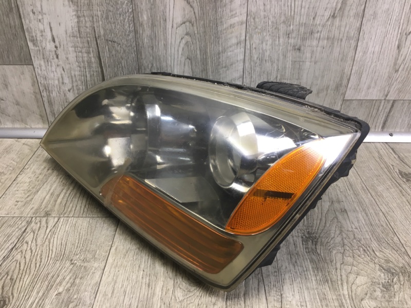 Фара левая KIA SORENTO BL 02-09