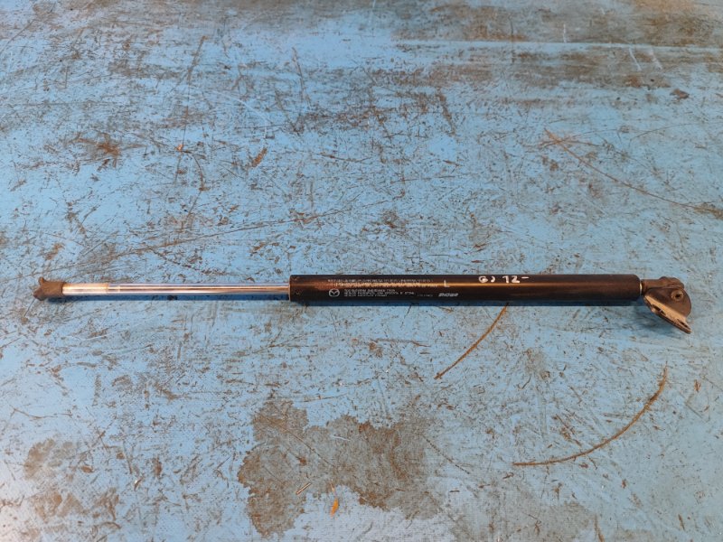 Амортизатор крышки багажника левый 6 GJ 12-