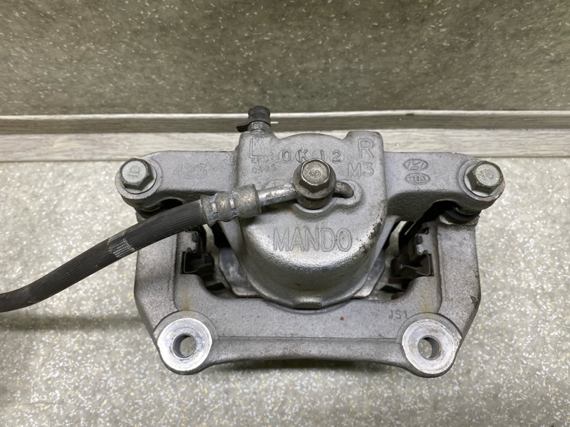 Суппорт тормозной передний левый KIA SOUL SK3 19- G4FJ 1.6