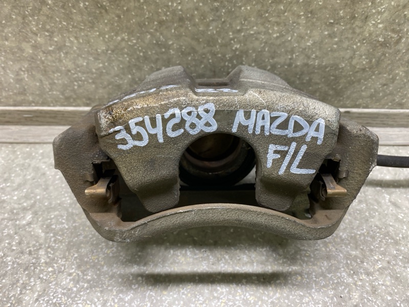 Суппорт тормозной передний левый 6 GJ 12-