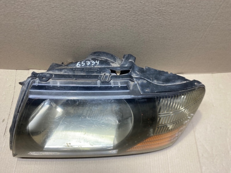 Фара передняя левая PAJERO 99-06