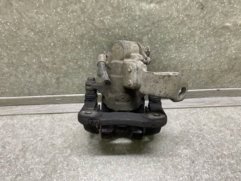 Суппорт тормозной задний правый CIVIC 4D 06-11