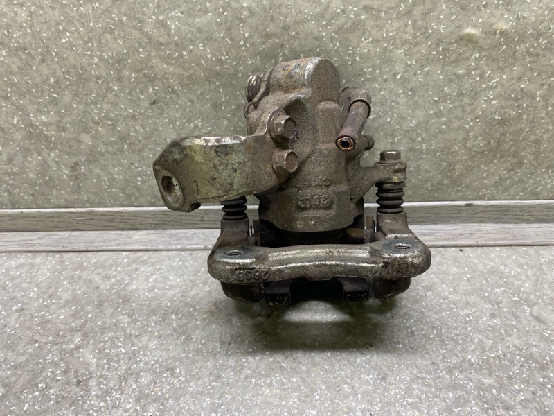 Суппорт тормозной задний левый CIVIC 4D 06-11