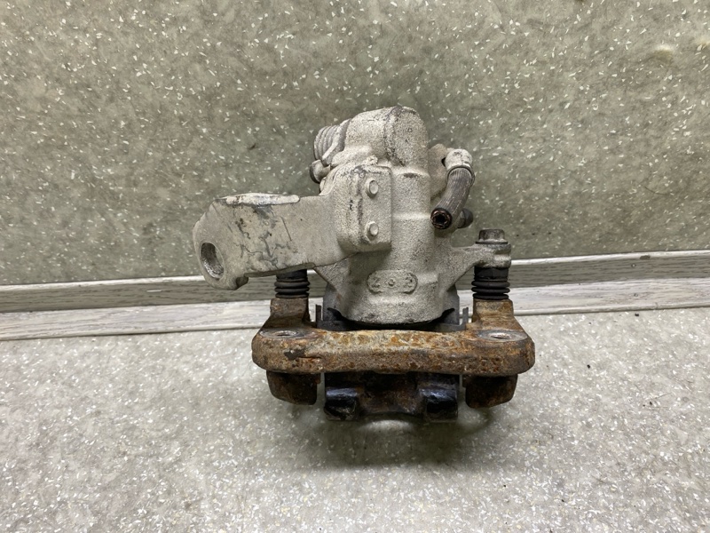 Суппорт тормозной задний левый CIVIC 4D 06-11