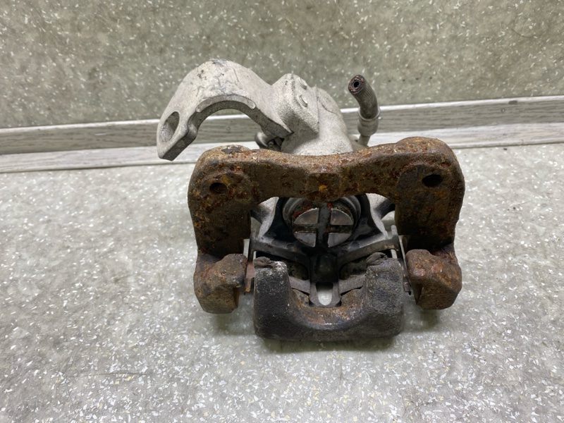 Суппорт тормозной задний левый HONDA CIVIC 4D 06-11