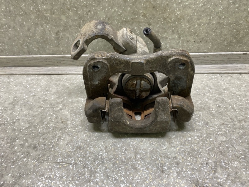 Суппорт тормозной задний левый HONDA CIVIC 4D 06-11