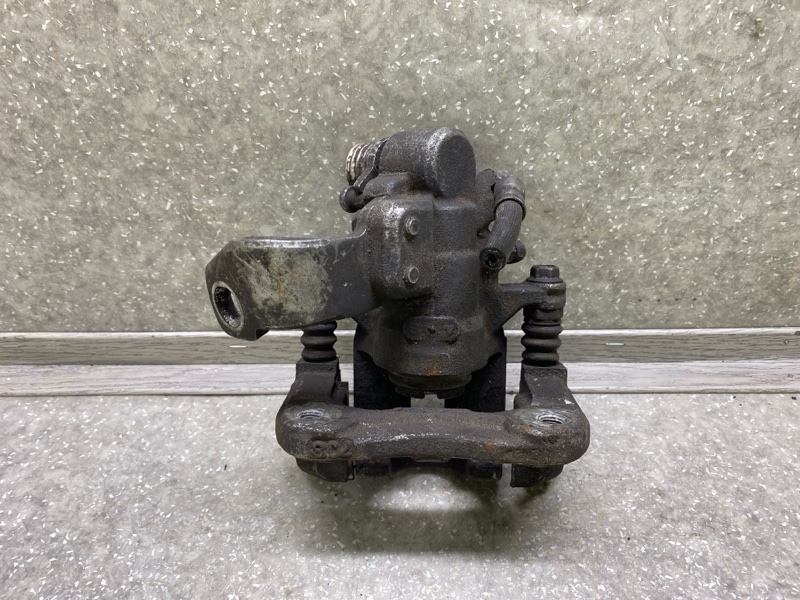 Суппорт тормозной задний левый CIVIC 4D 06-11