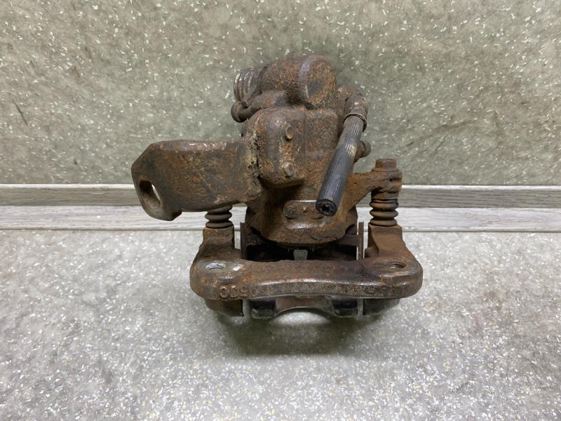 Суппорт тормозной задний левый CIVIC 4D 06-11